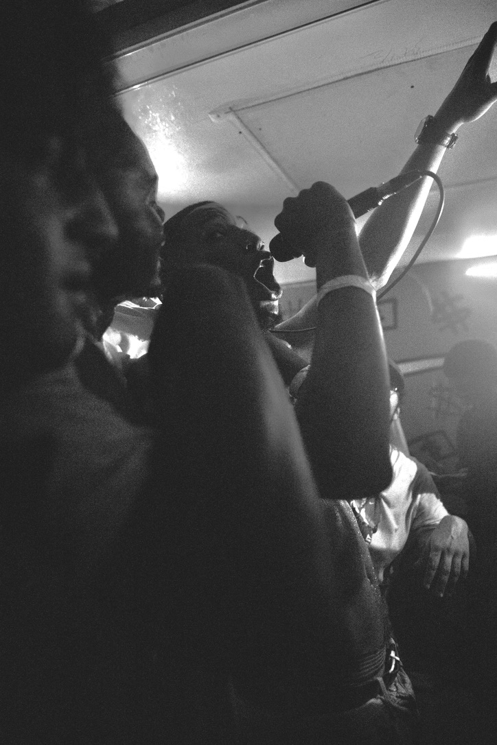 Rock Benjamins with mic raised mid-performance